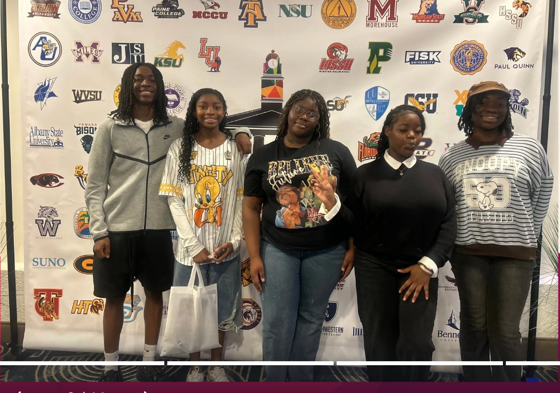 Five students standing in front of a backdrop covered in college and university logos.